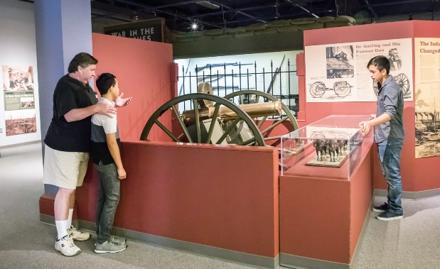 Family and Gatling Gun in Earl Exhibit