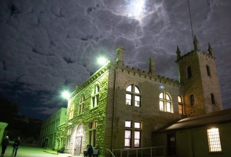 Old Idaho Penitentiary entrance at night.
