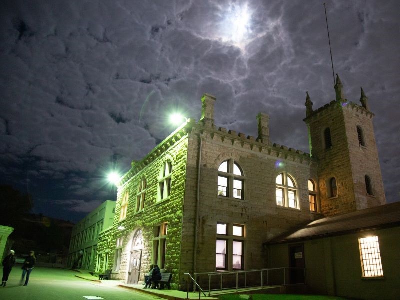 Old Idaho Penitentiary entrance at night.