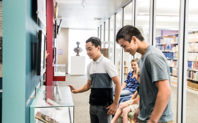 Family Looking at Idaho State Archives Exhibit