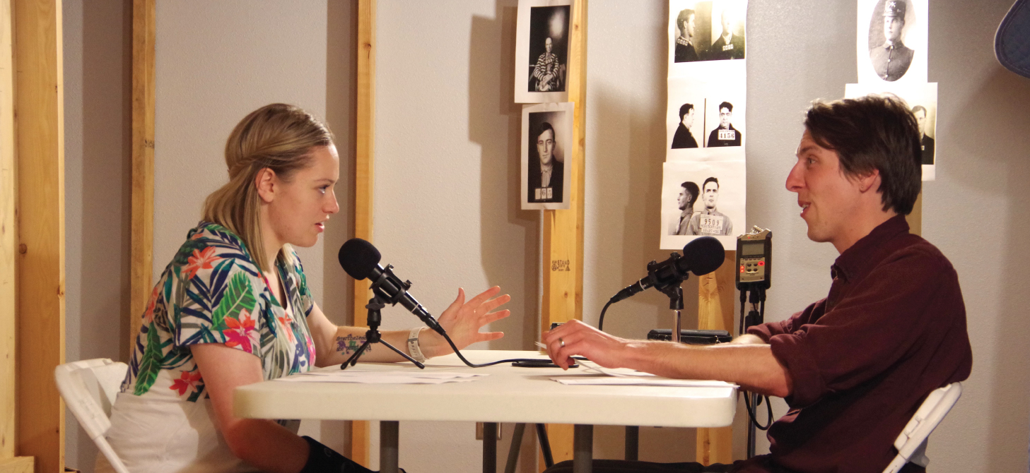 Two People Filming the Behind Gray Walls Podcast