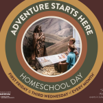 Children standing in front of a bronze Sacajawea sculpture inside the Idaho State Museum.