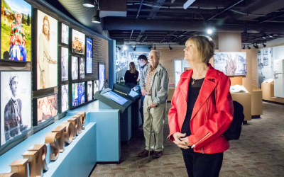Adults viewing an Exhibit at the Idaho State Museum