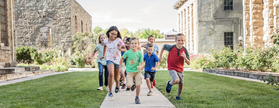 Kids Running Through the Yard at the Old Pen